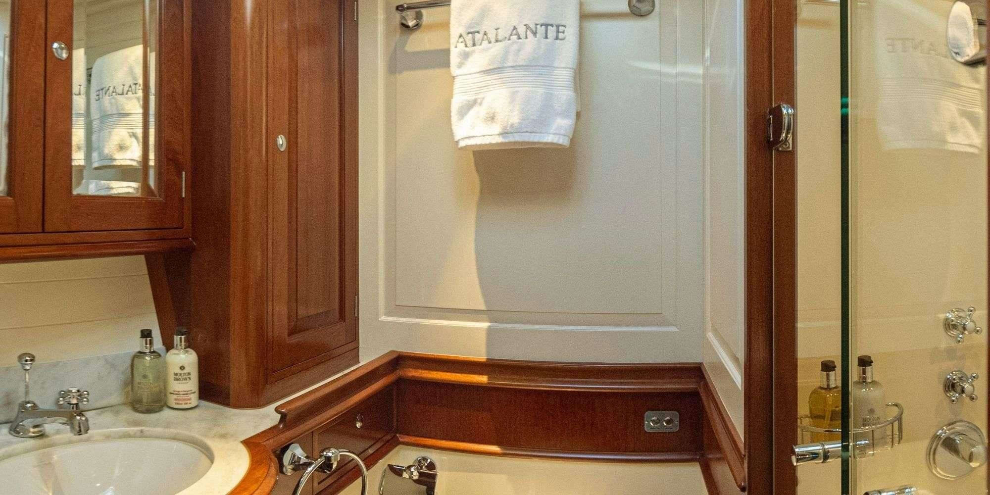 a bathroom with a mirror and sink aboard ATALANTE Yacht for Charter
