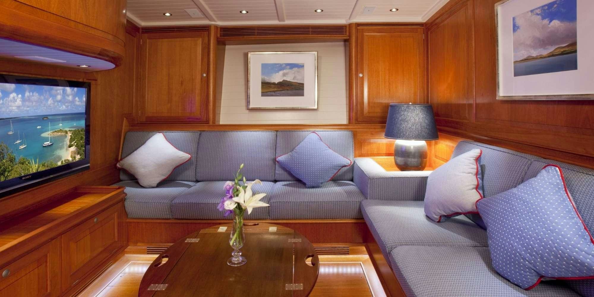a living room with a large television aboard ATALANTE Yacht for Charter