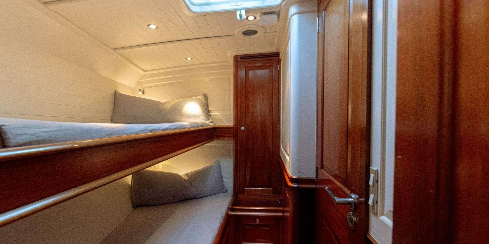 a bed in a room aboard ATALANTE Yacht for Charter