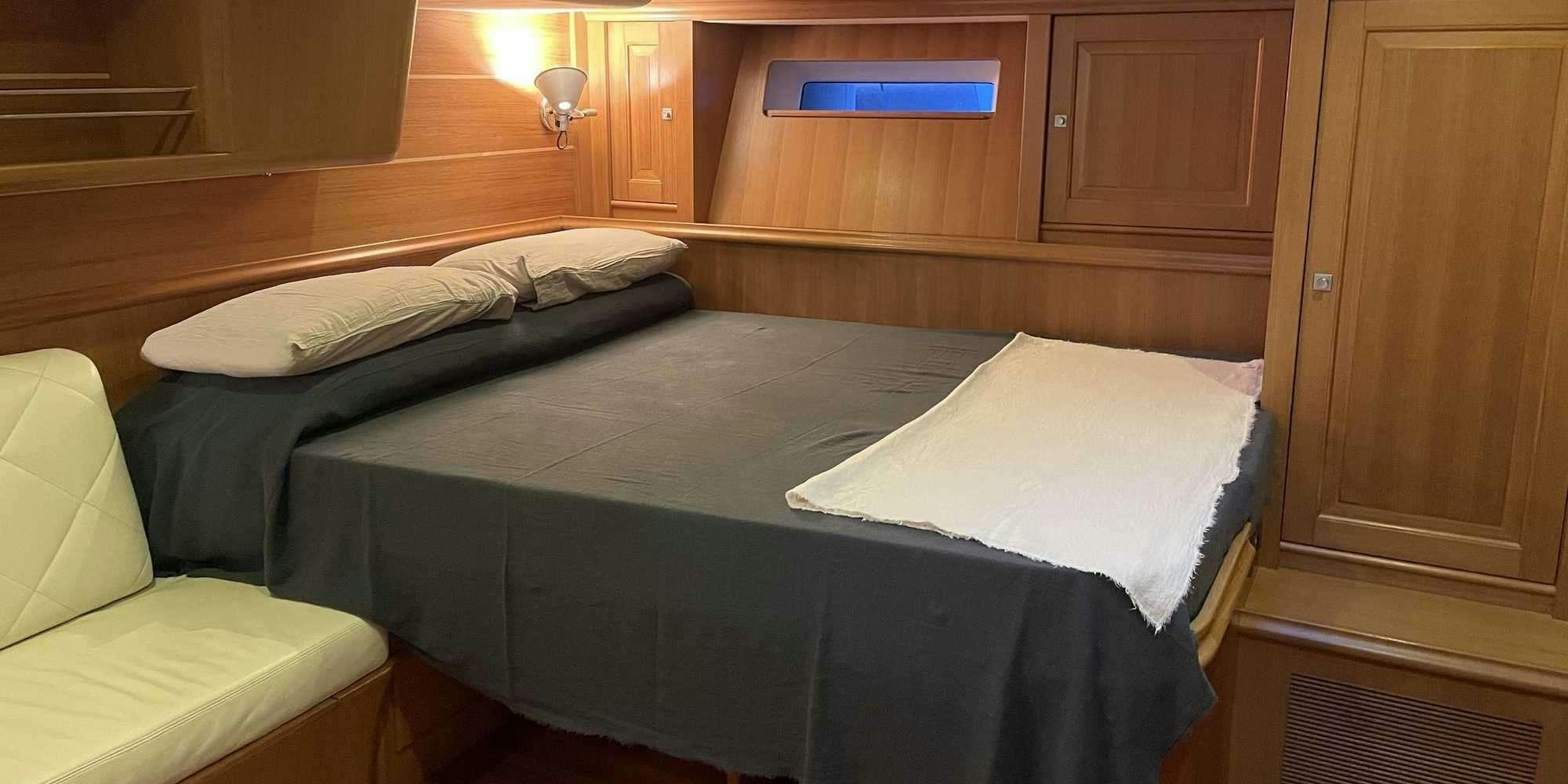 a room with two beds aboard LA VIDELLE Yacht for Charter