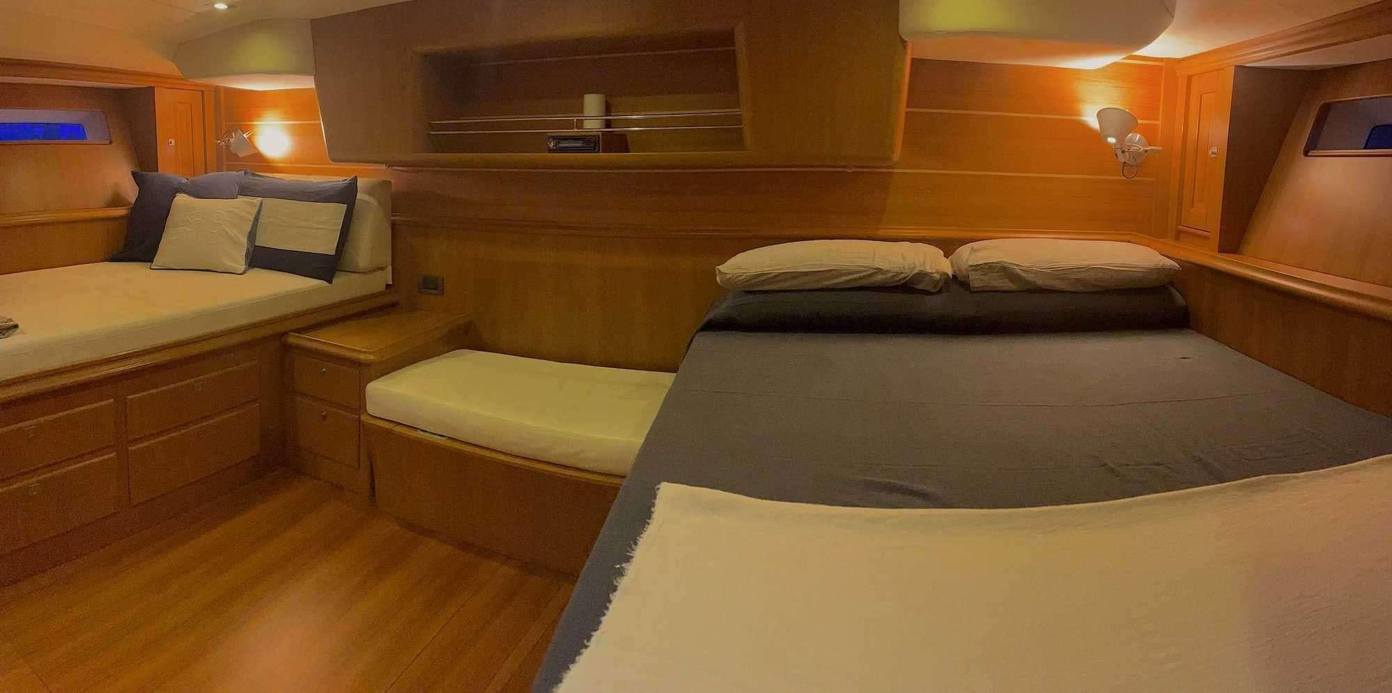 a room with two beds aboard LA VIDELLE Yacht for Charter