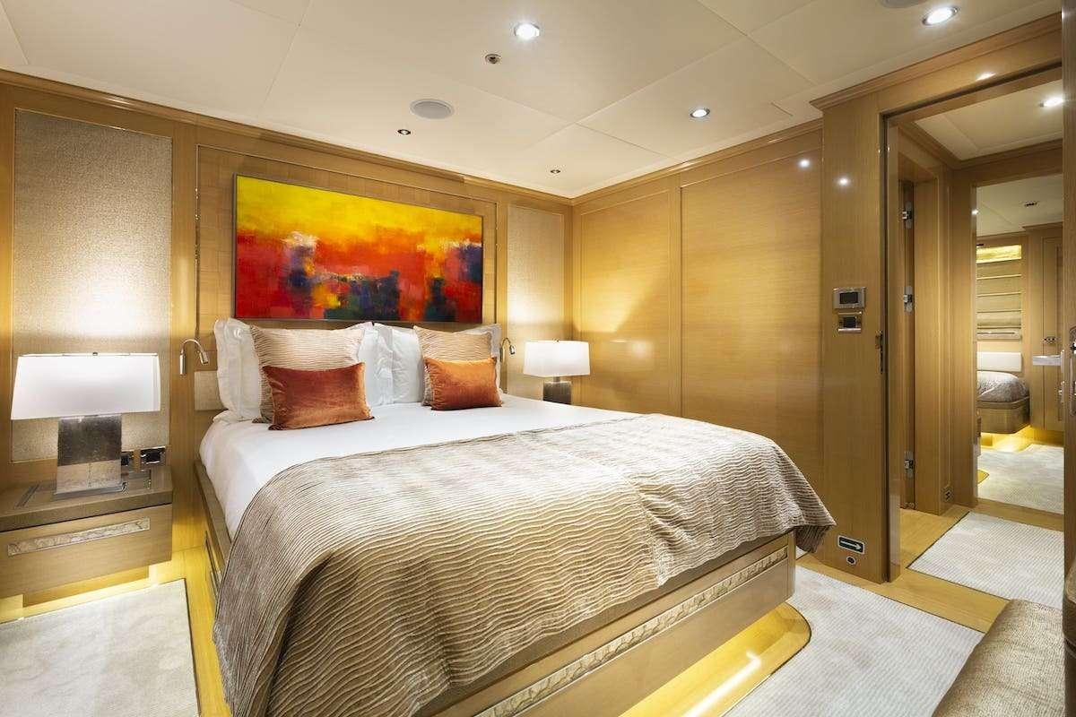 a large bed in a hotel room aboard AUDACES Yacht for Charter