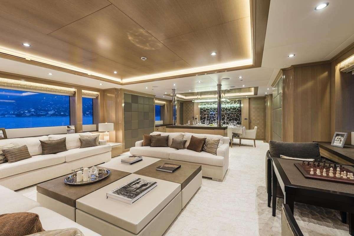 a living room with a large screen aboard AUDACES Yacht for Charter