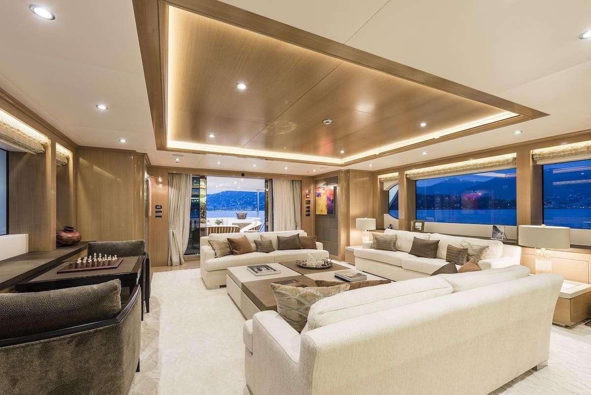 a large living room with a large screen aboard AUDACES Yacht for Charter