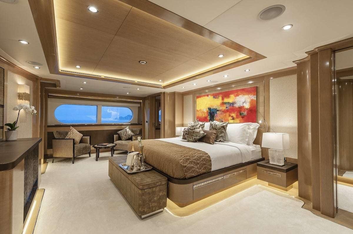 a large bedroom with a large bed aboard AUDACES Yacht for Charter