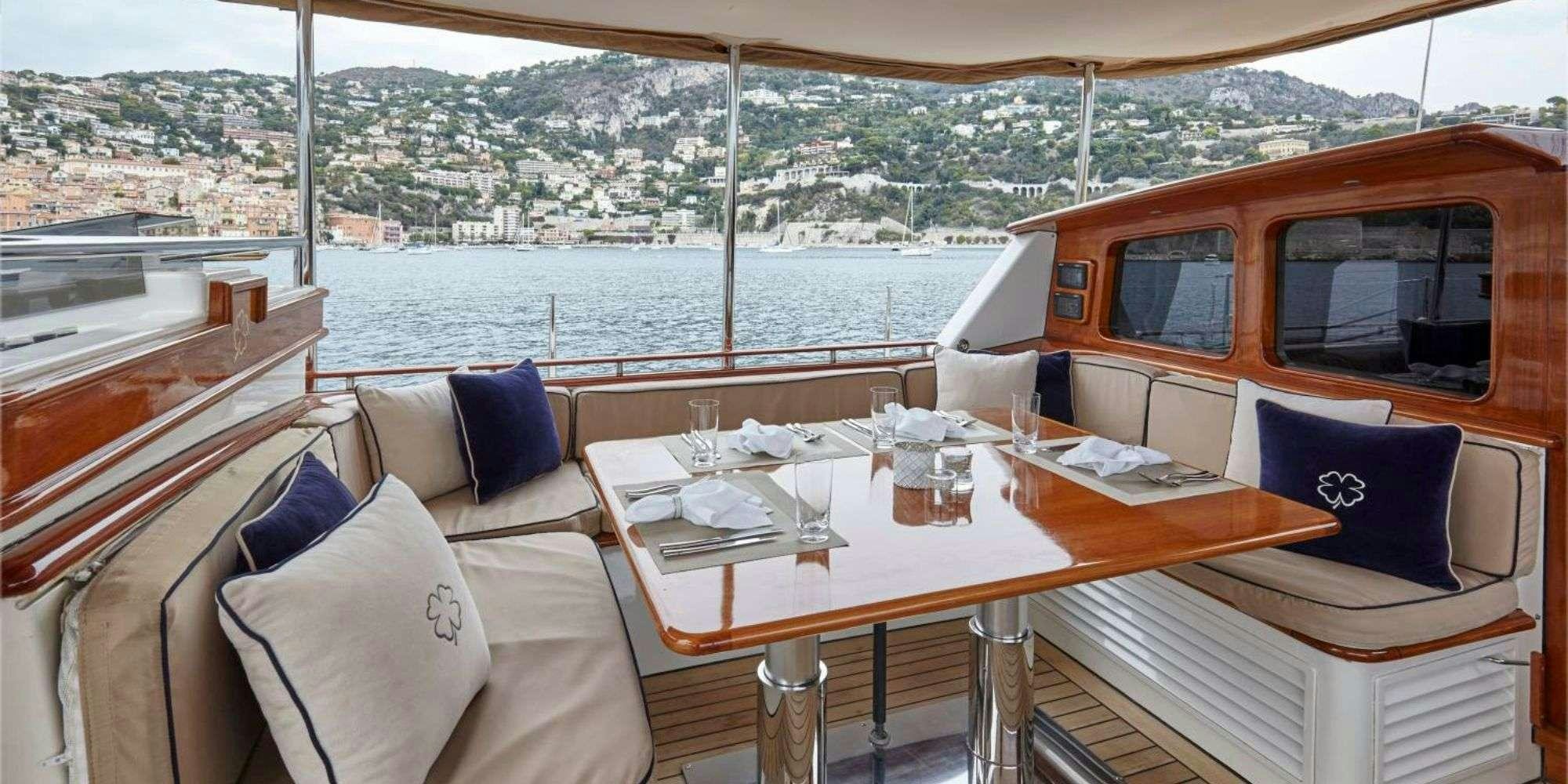 a table with pillows on it aboard IRELANDA Yacht for Charter