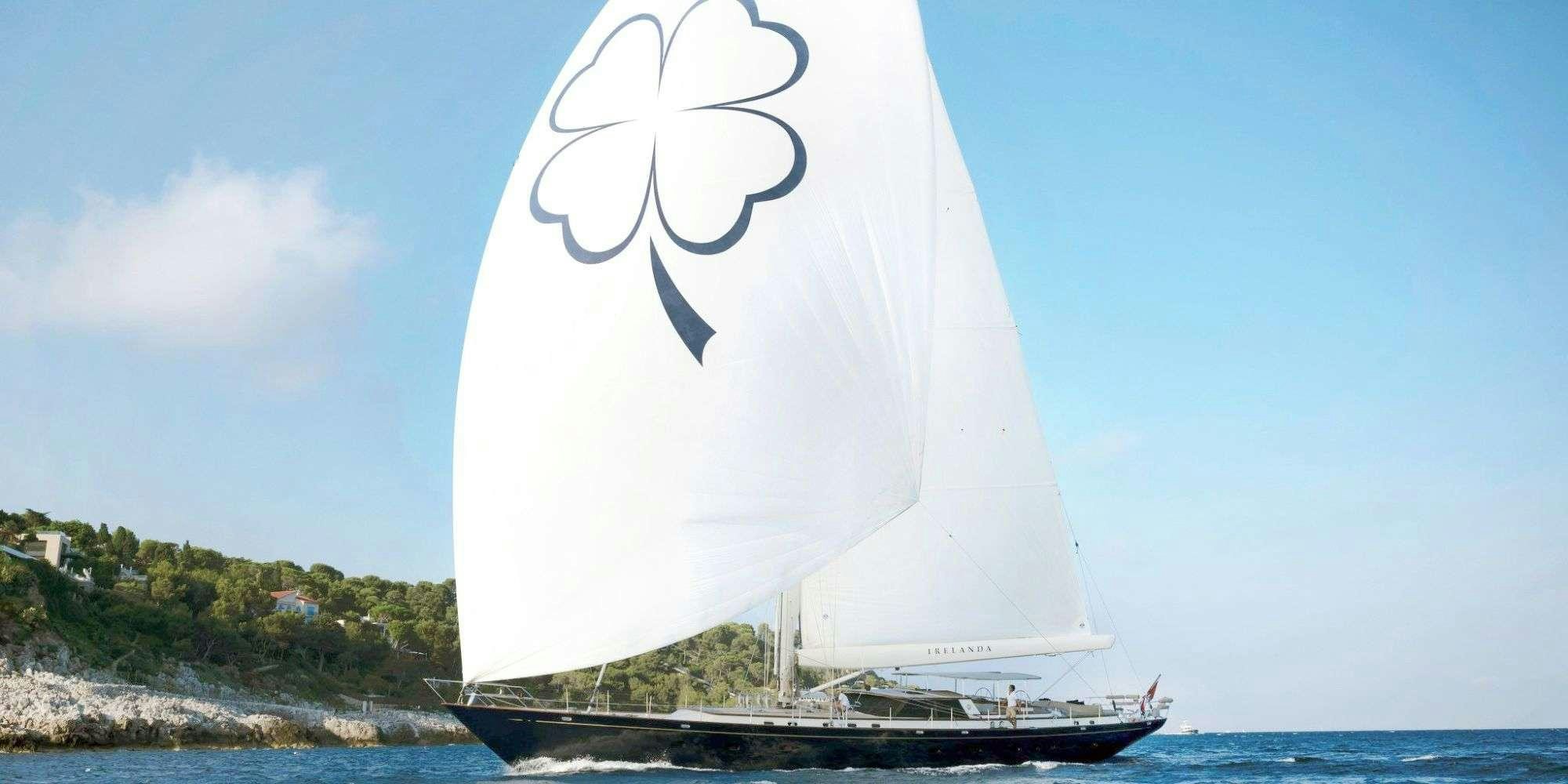 a sailboat with a drawing of a bird on it aboard IRELANDA Yacht for Charter