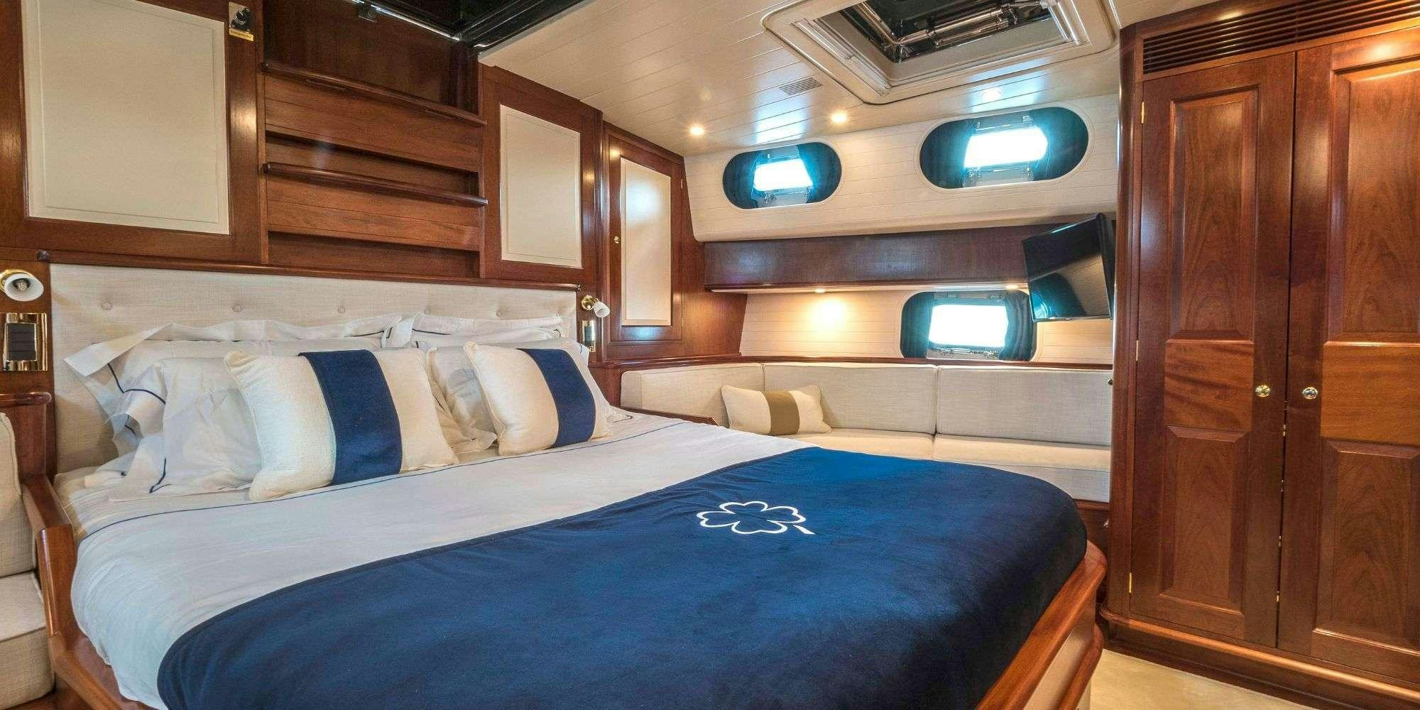 a bed in a room aboard IRELANDA Yacht for Charter
