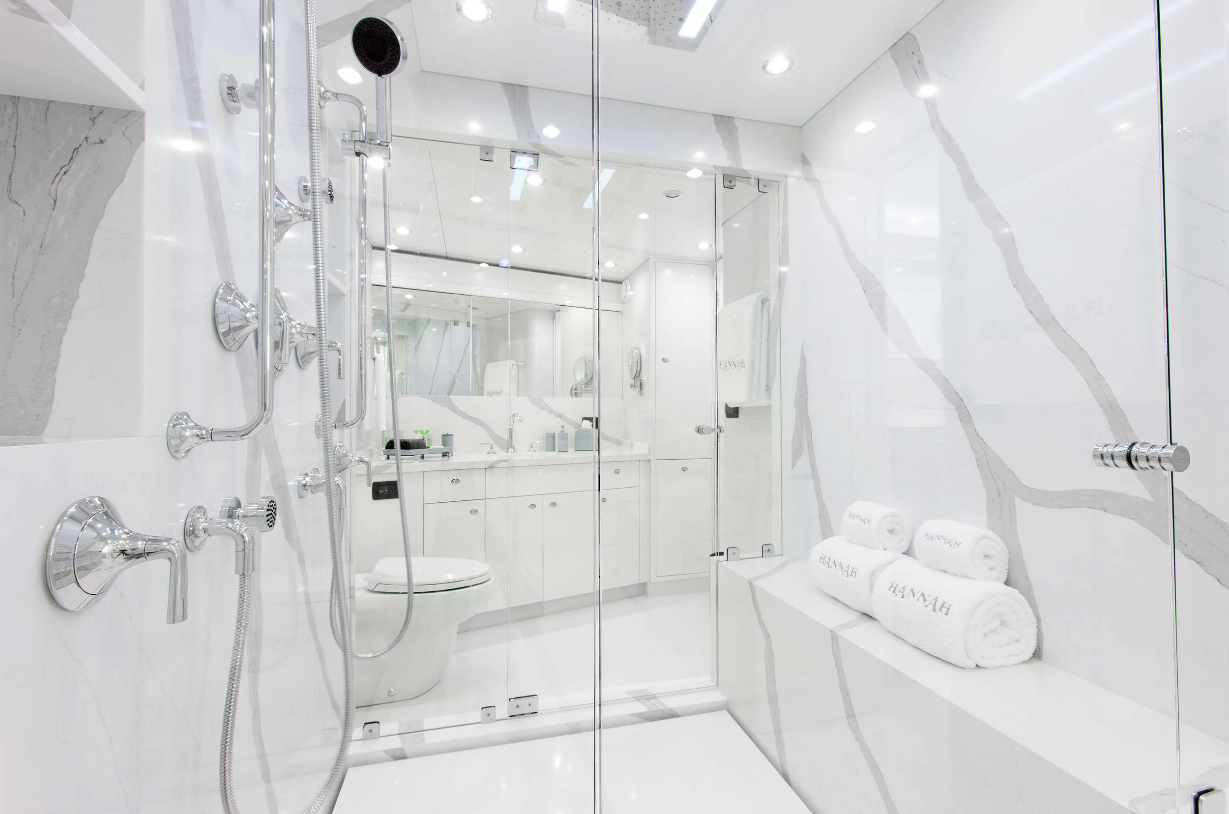 a bathroom with a glass shower aboard HANNAH Yacht for Charter
