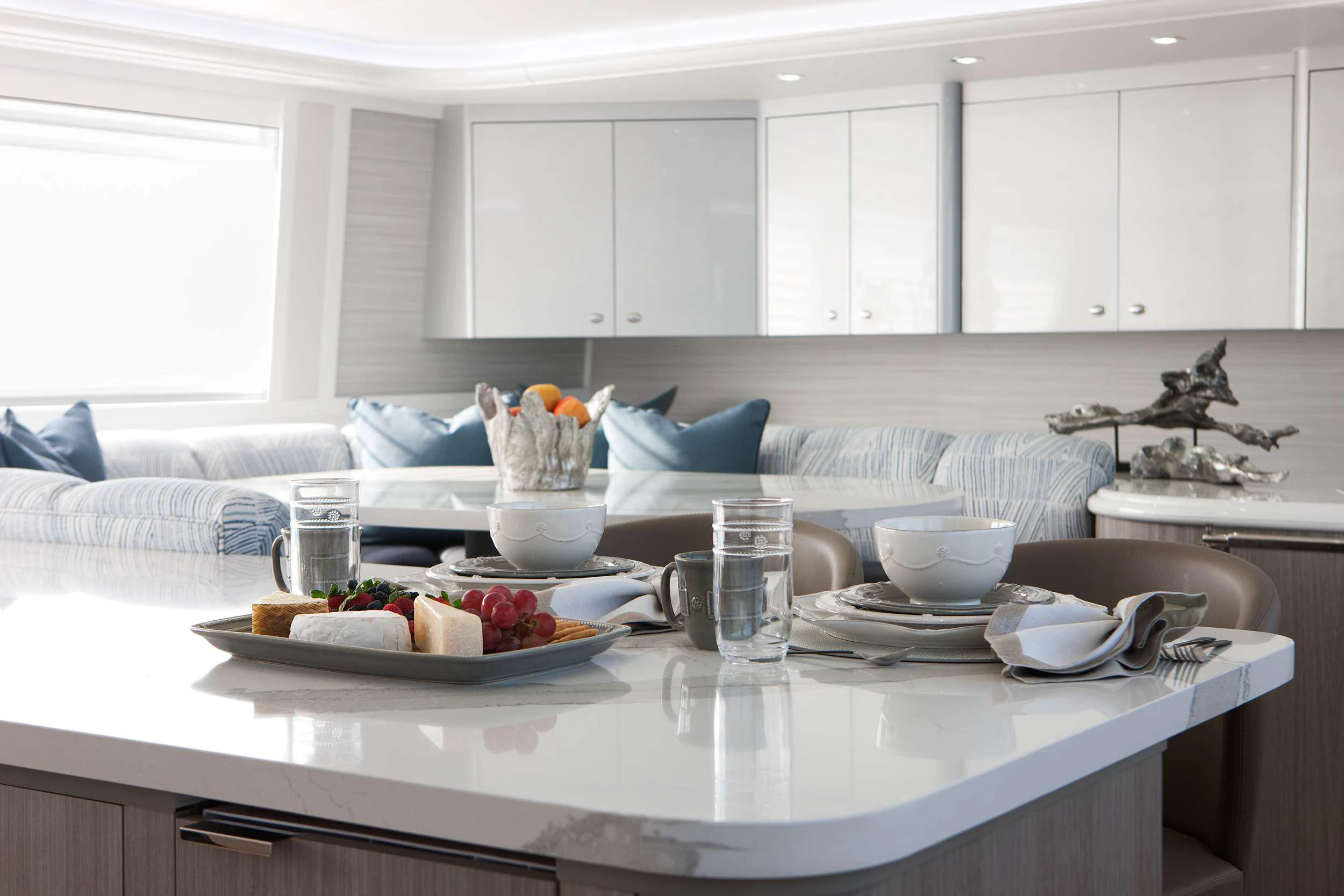 a kitchen with white cabinets aboard HANNAH Yacht for Charter