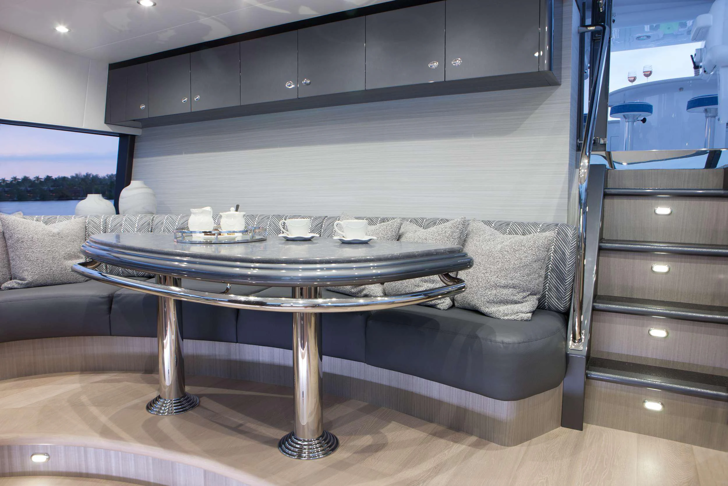a living room with a table and couches aboard HANNAH Yacht for Charter
