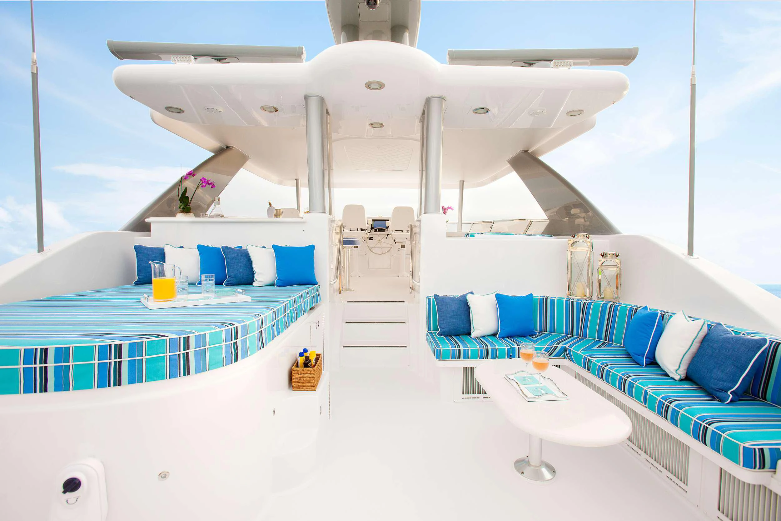 a large white ship with blue seats aboard HANNAH Yacht for Charter