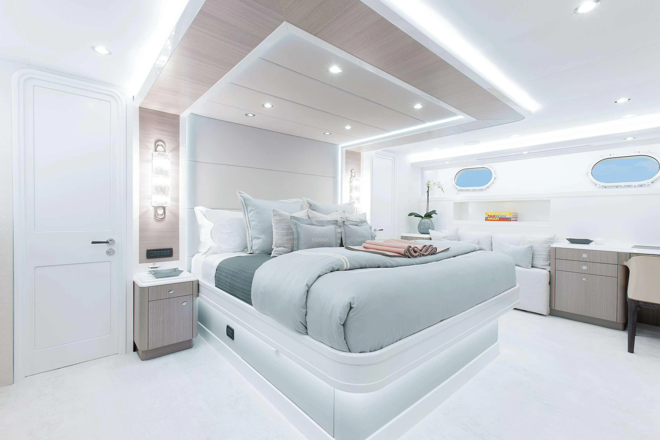 a room with a bed and a desk aboard HANNAH Yacht for Charter