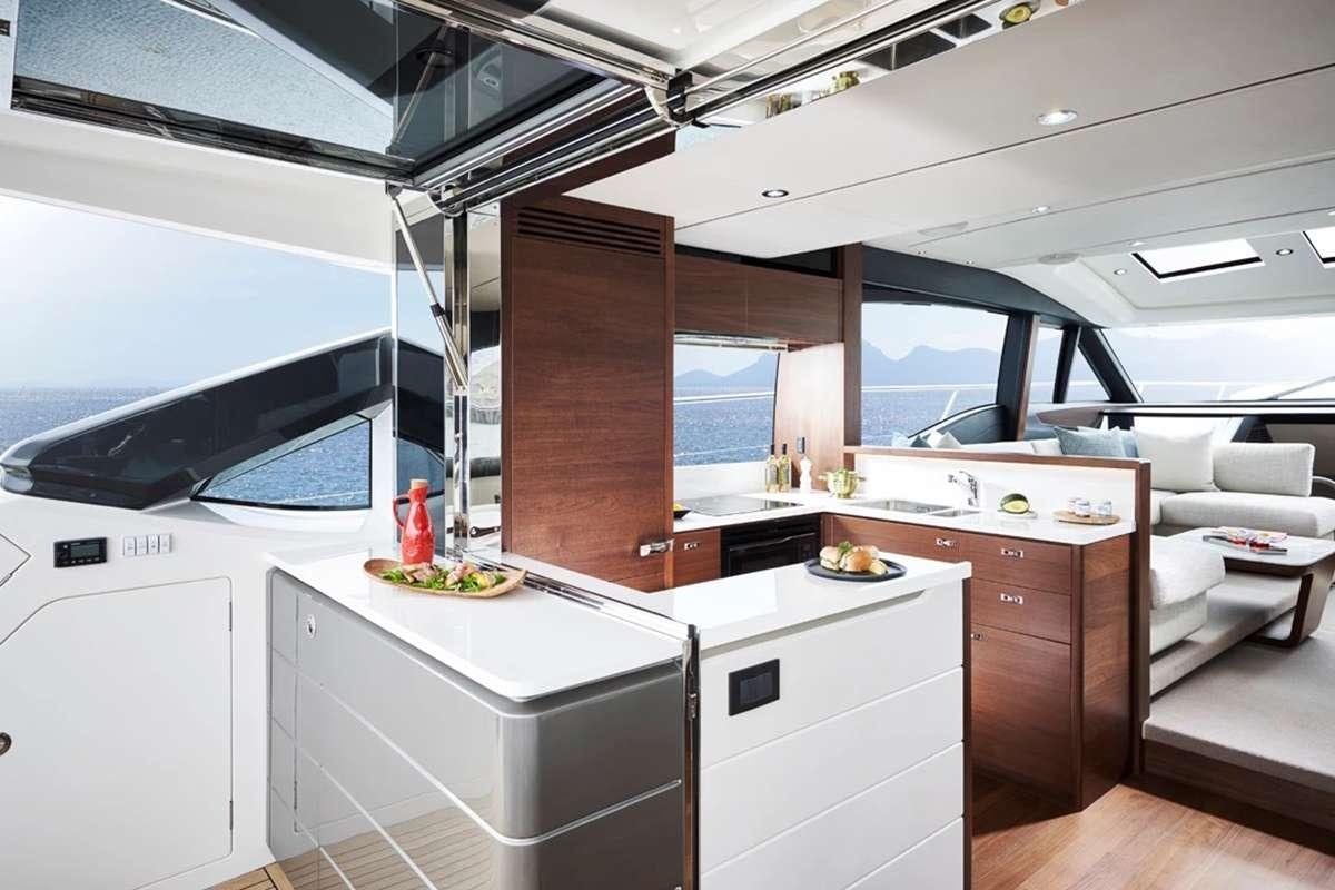a kitchen with a large window aboard CHAMELEON III Yacht for Charter