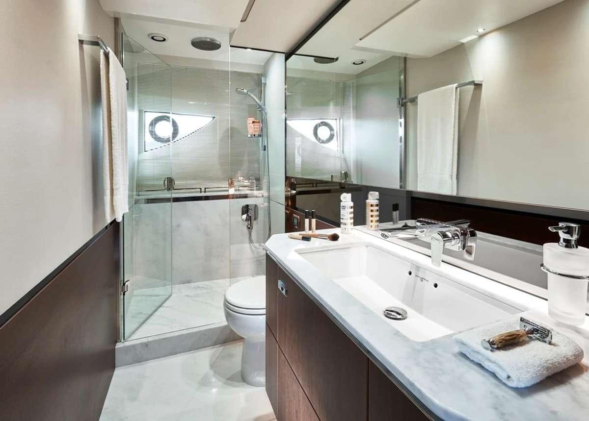 a bathroom with a glass shower aboard CHAMELEON III Yacht for Charter