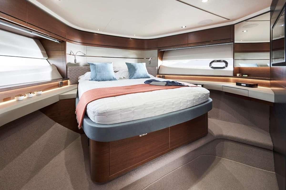 a bed in a room aboard CHAMELEON III Yacht for Charter