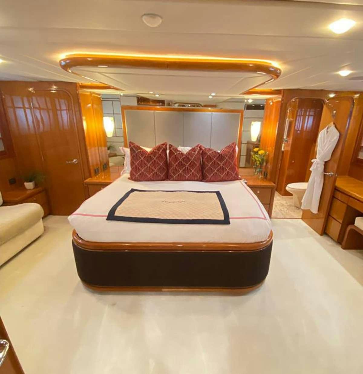a bed in a room aboard TRIPLE NET Yacht for Charter
