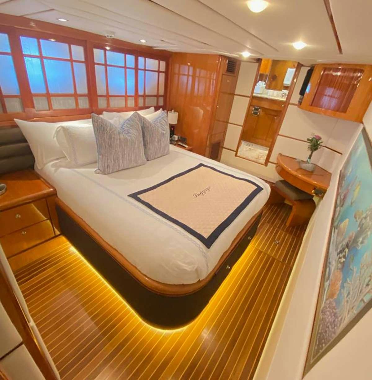 a bed in a room aboard TRIPLE NET Yacht for Charter