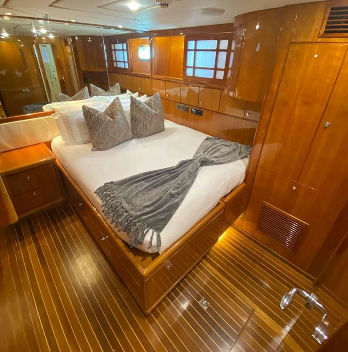 a bed in a room aboard TRIPLE NET Yacht for Charter
