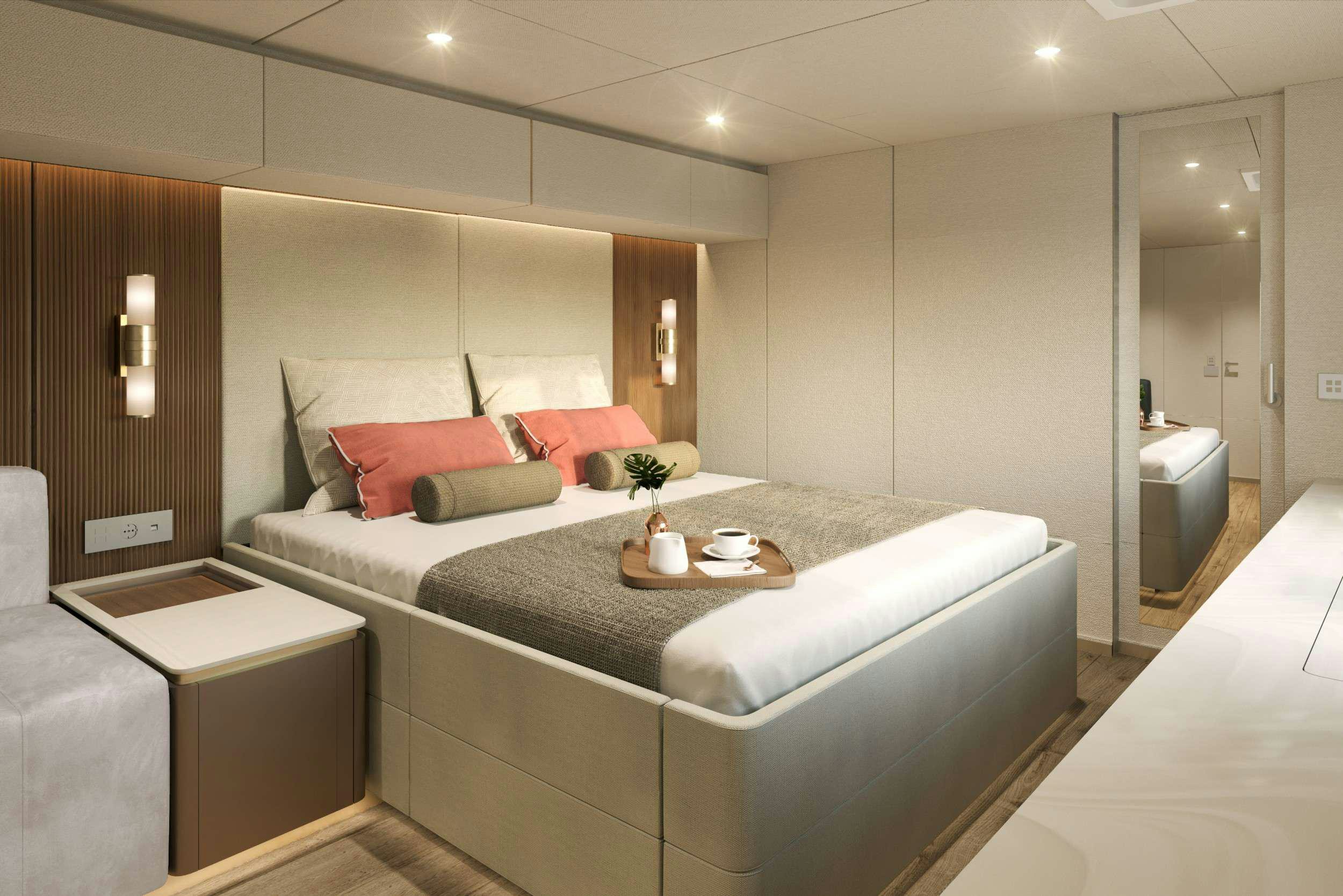 a bed with a white bed spread aboard VIVA LA VIDA Yacht for Charter