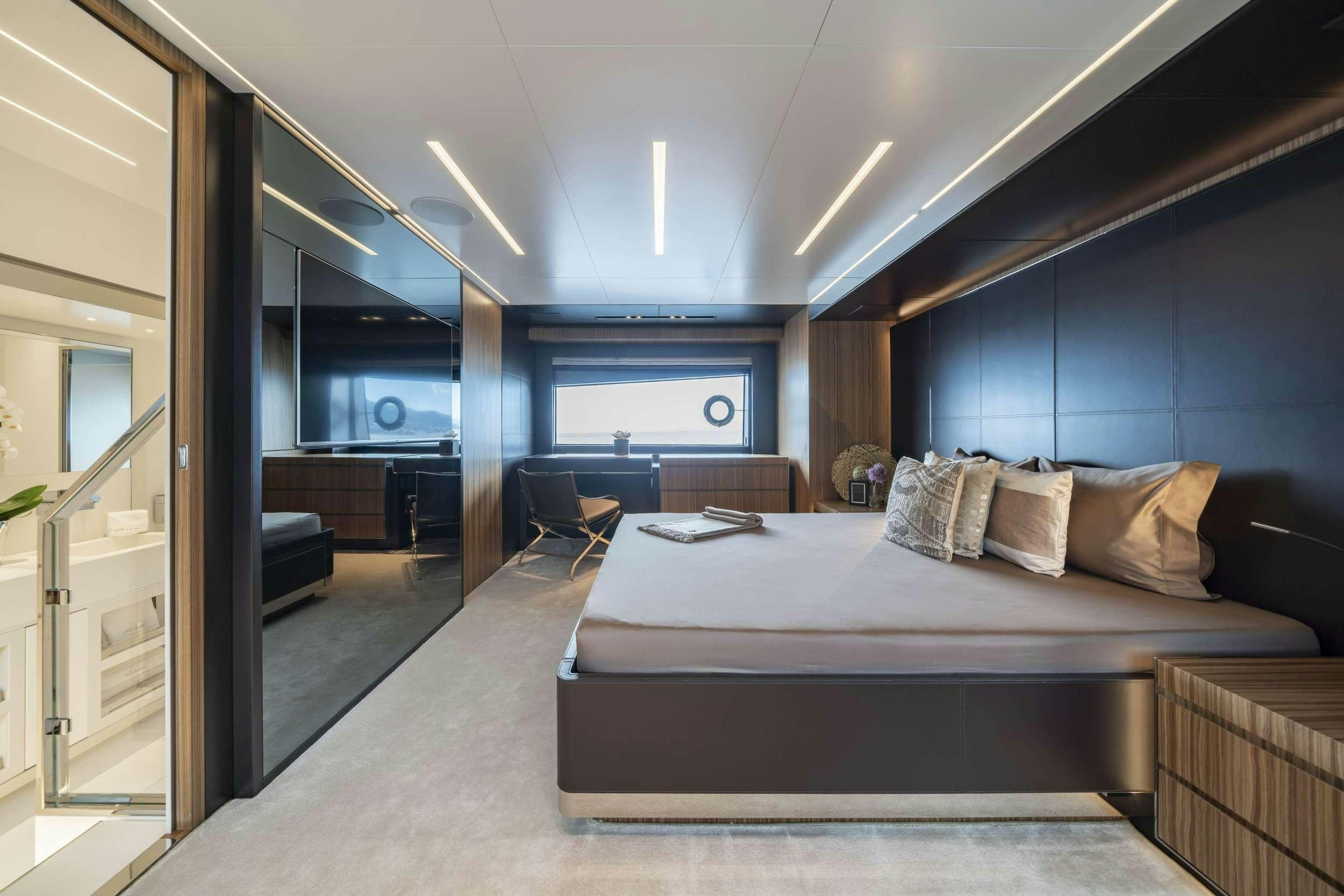 a large bed in a room aboard MAXIMUS Yacht for Charter