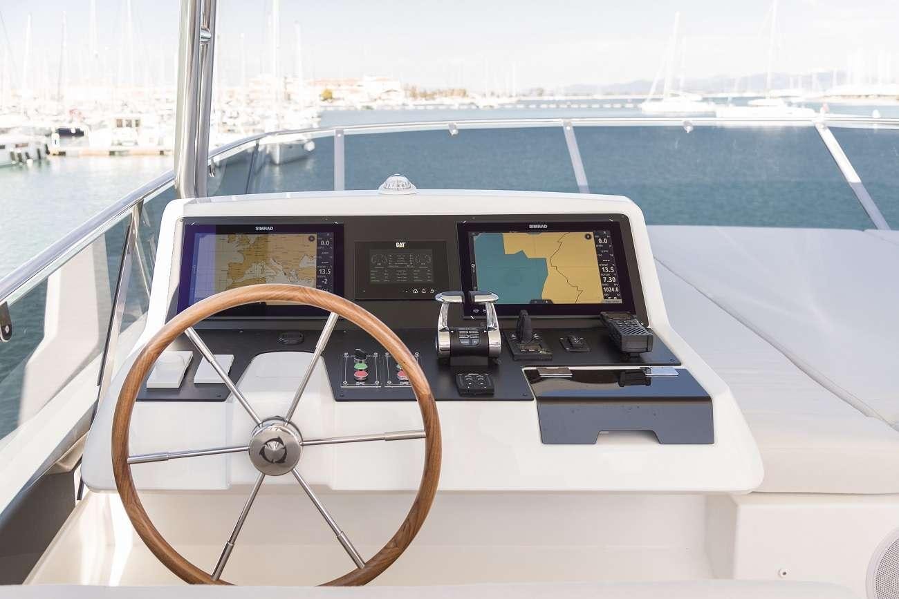 a steering wheel on a boat aboard SIR HENDRIK Yacht for Charter