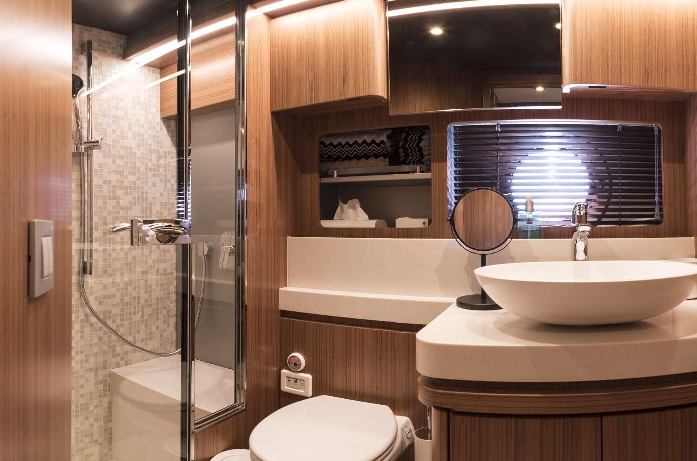 a bathroom with a sink and a mirror aboard SIR HENDRIK Yacht for Charter