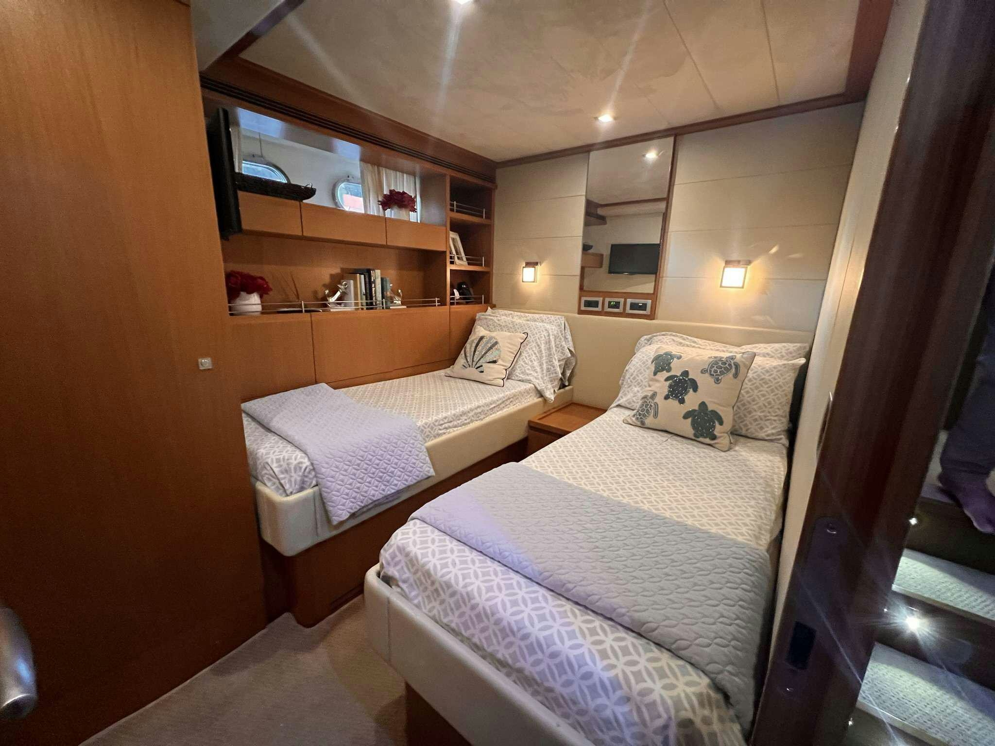 a room with two beds aboard DESTINY Yacht for Charter