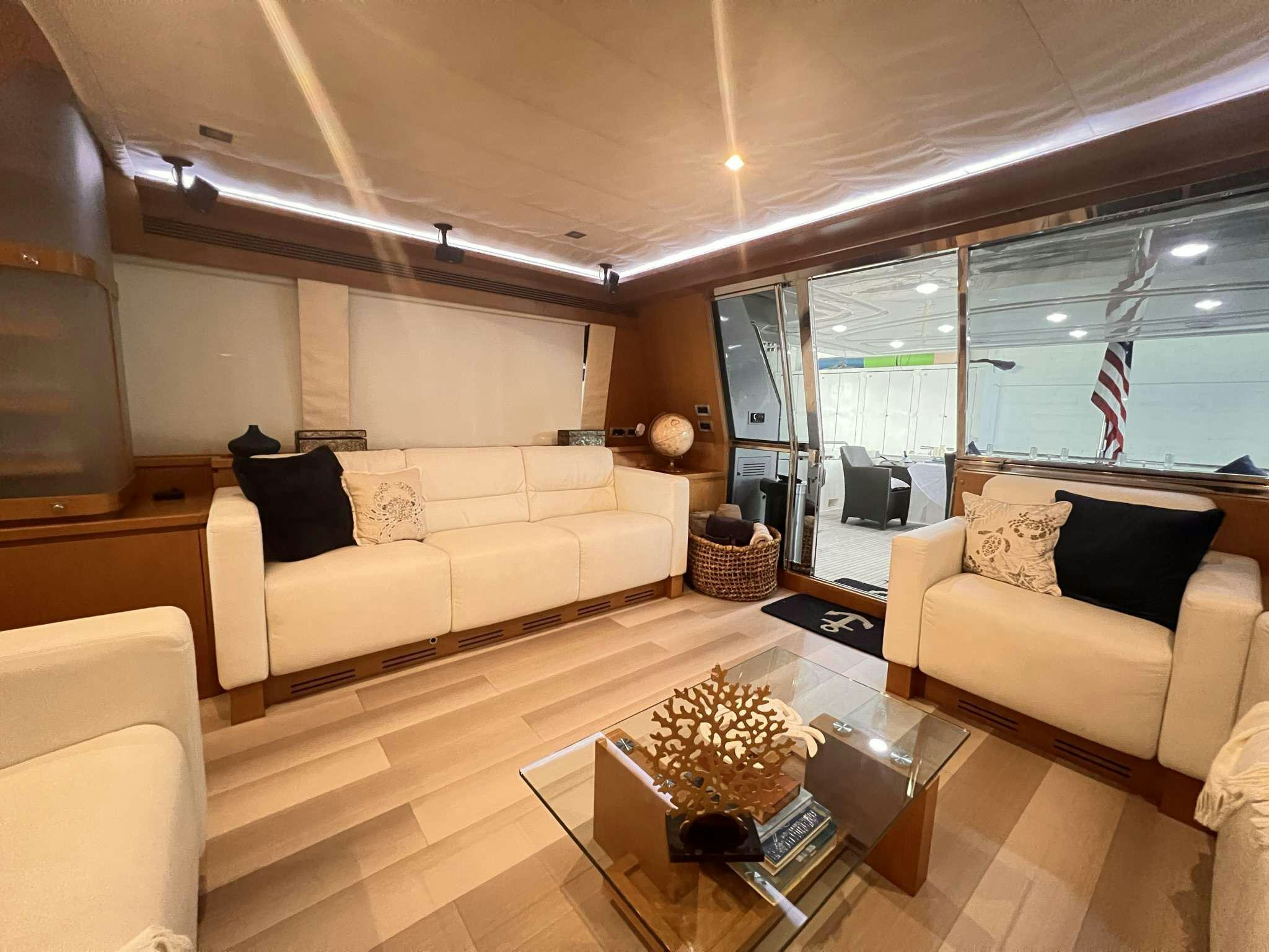 a living room with a large window aboard DESTINY Yacht for Charter