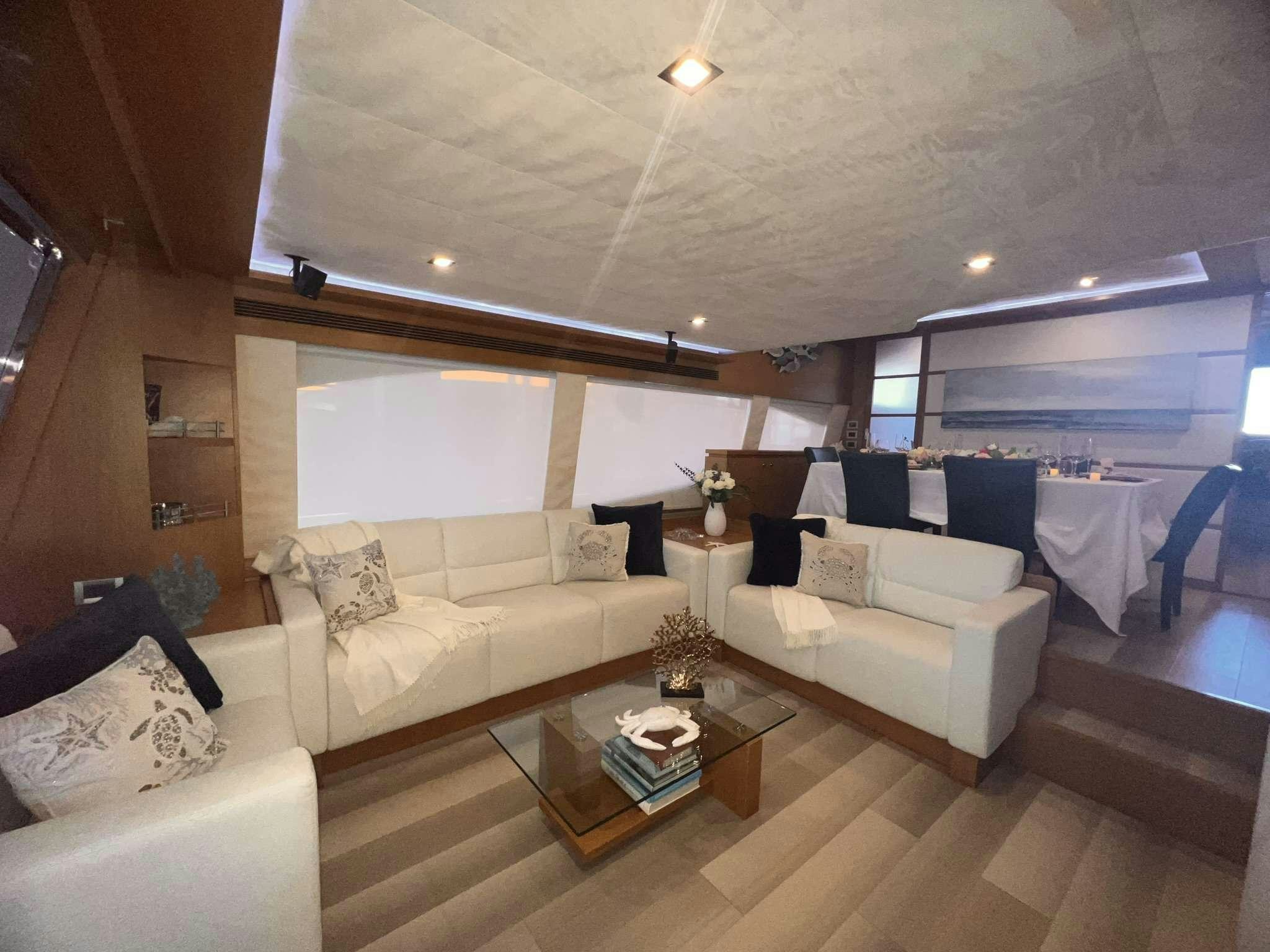 a living room with a large window aboard DESTINY Yacht for Charter