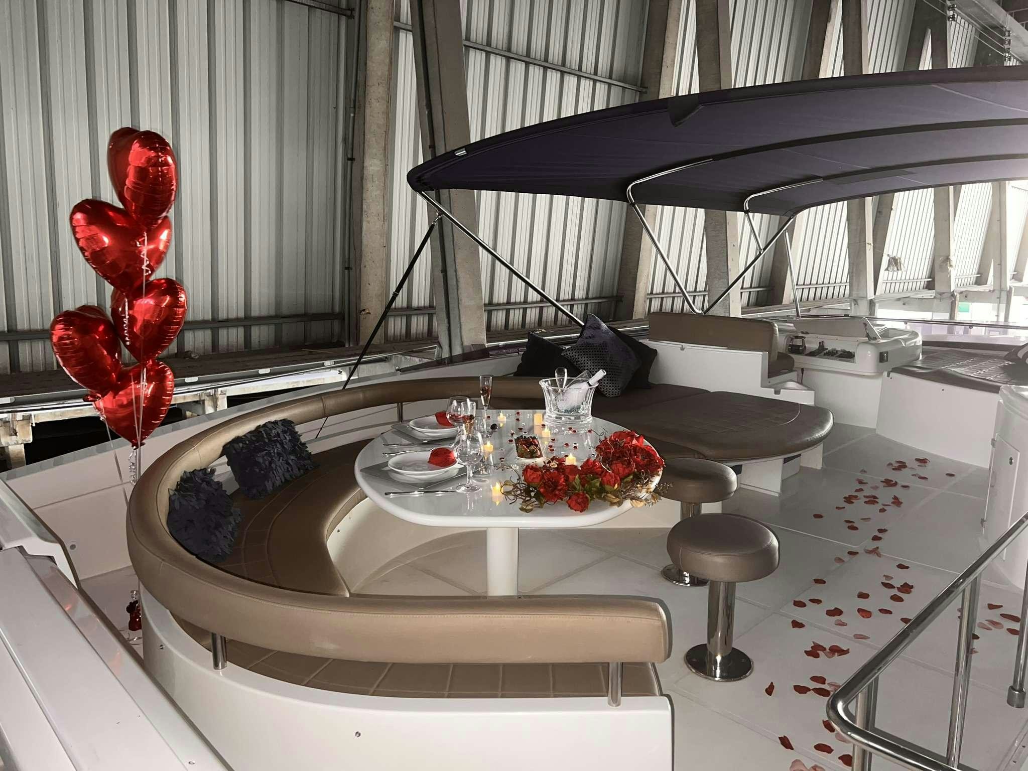 a room with a table and chairs aboard DESTINY Yacht for Charter