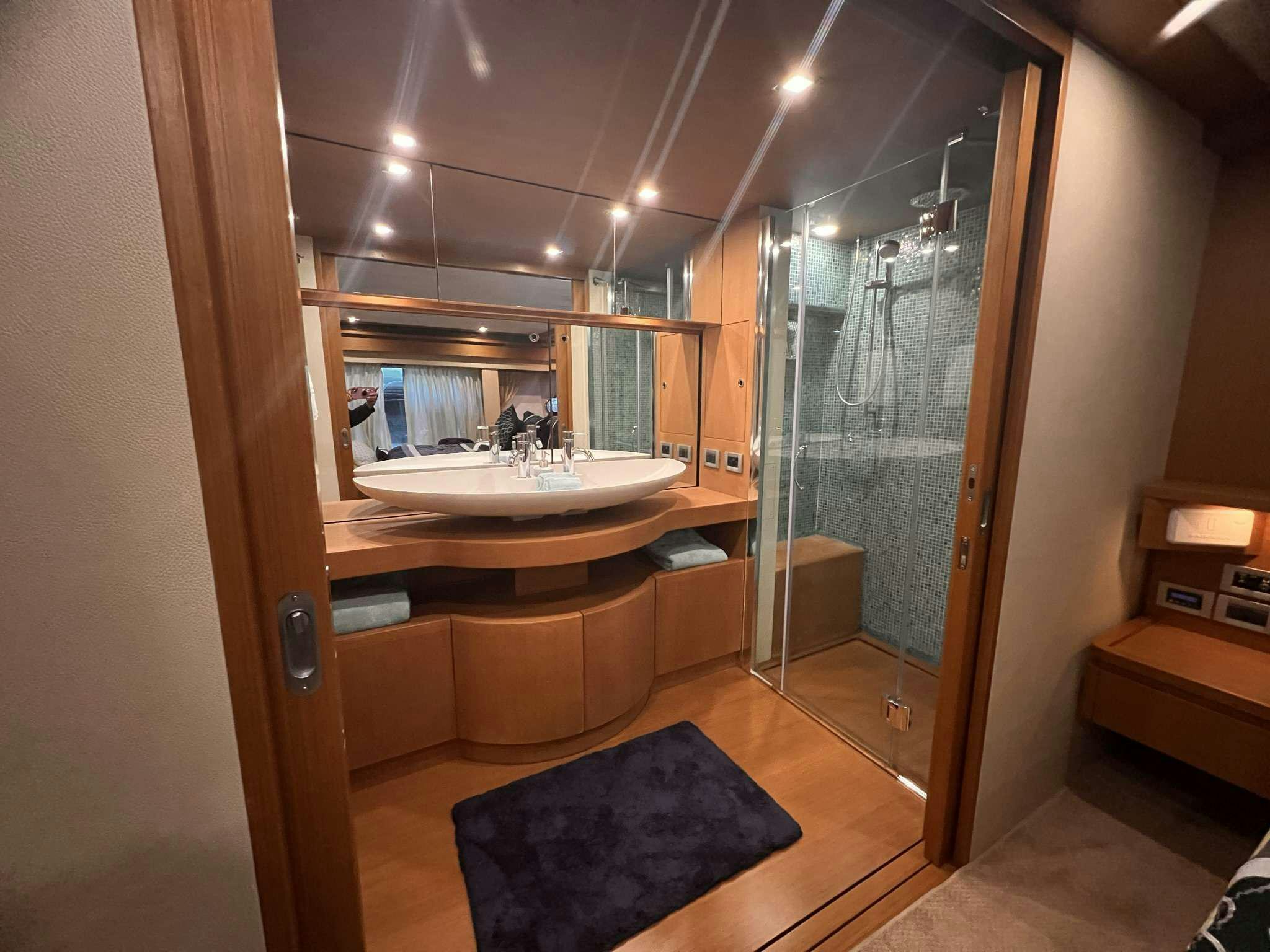 a bathroom with a glass shower aboard DESTINY Yacht for Charter