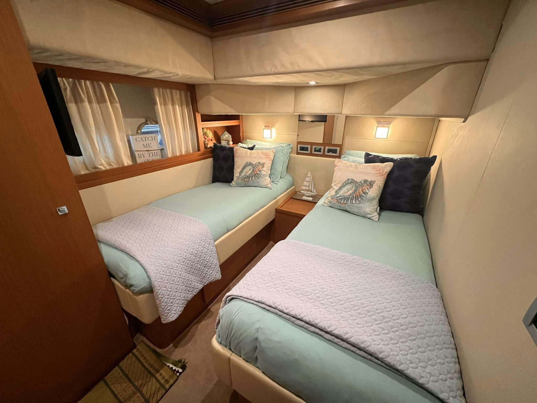 a couple of beds in a room aboard DESTINY Yacht for Charter