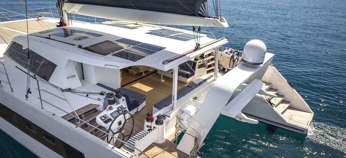 a large white boat on the water aboard NEPTUNE Yacht for Charter