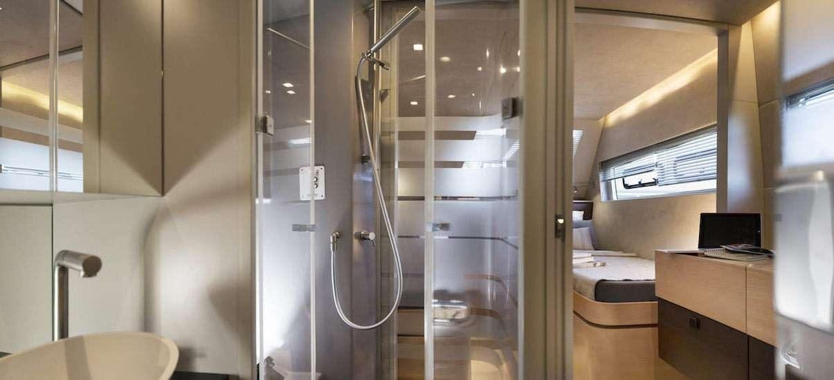a room with a glass door and a glass wall aboard NEPTUNE Yacht for Charter