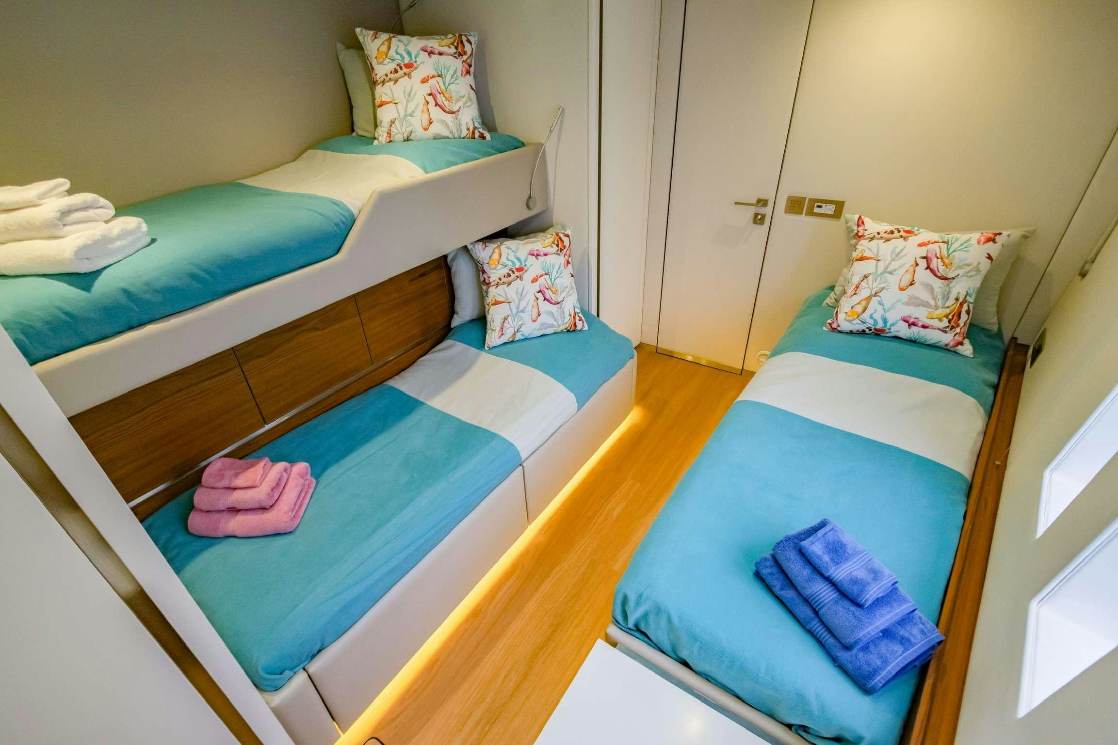 a couple of beds in a room aboard SUNREEF 80 FANTASTIC TOO Yacht for Charter