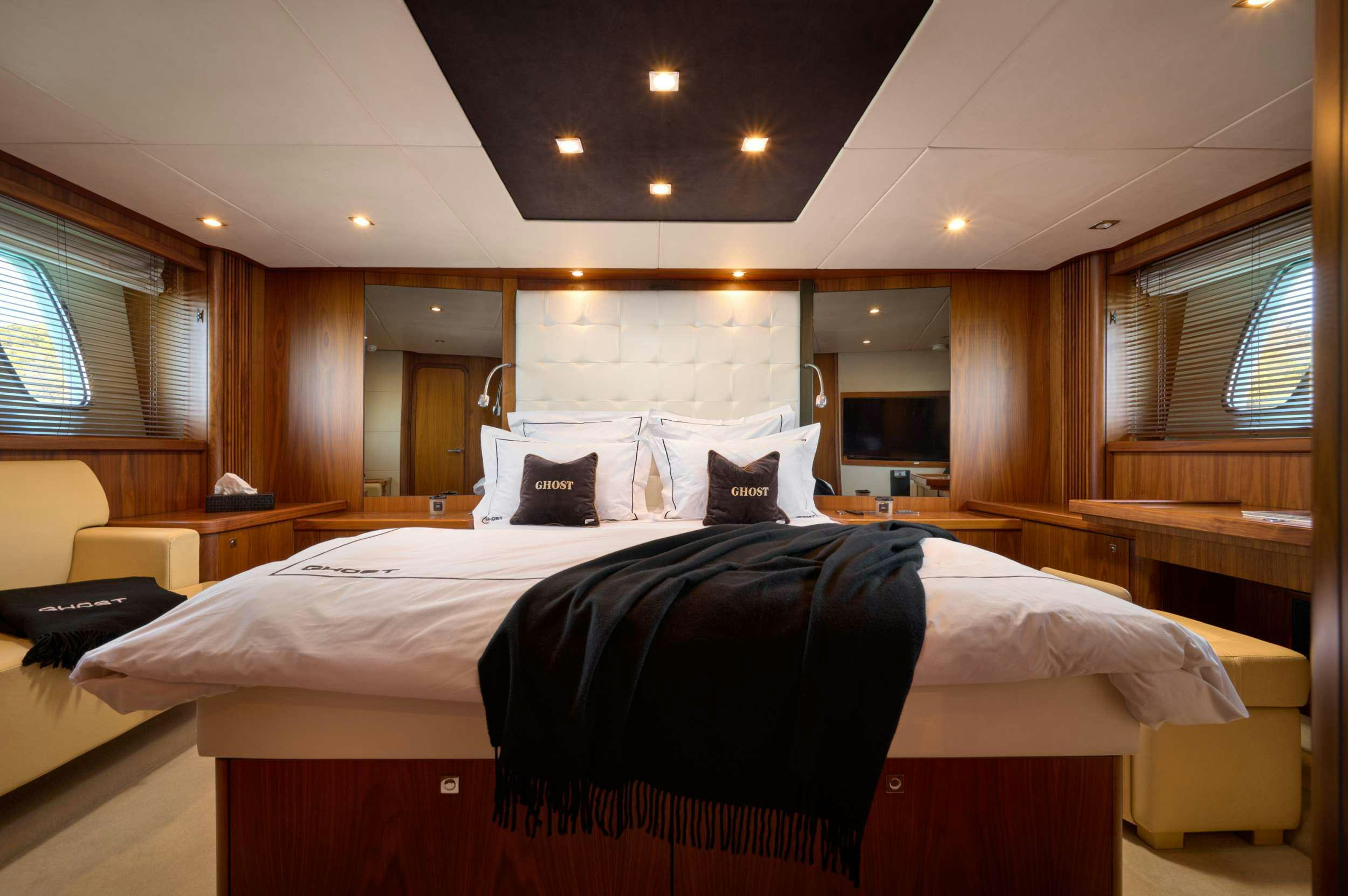 a hotel room with a bed aboard SUNSEEKER PREDATOR 72 GHOST Yacht for Charter