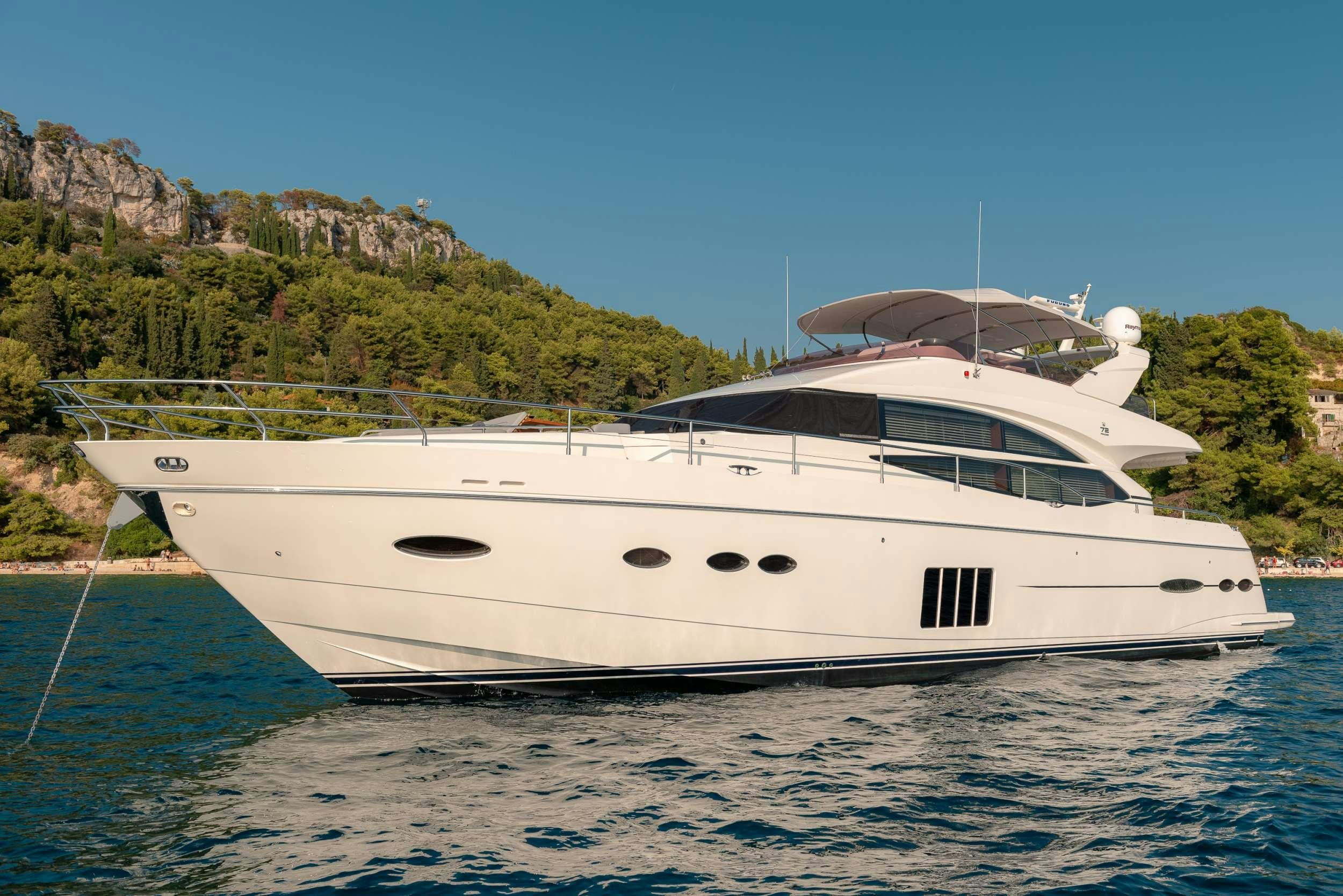 a white yacht in the water aboard PRINCESS 72 FLY CHAMPION Yacht for Charter