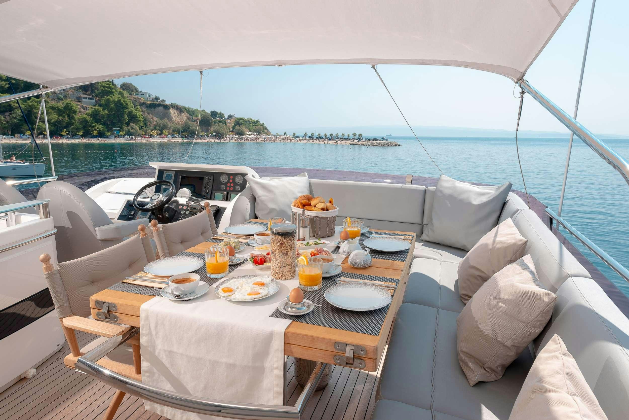 a table with food on it aboard PRINCESS 72 FLY CHAMPION Yacht for Charter