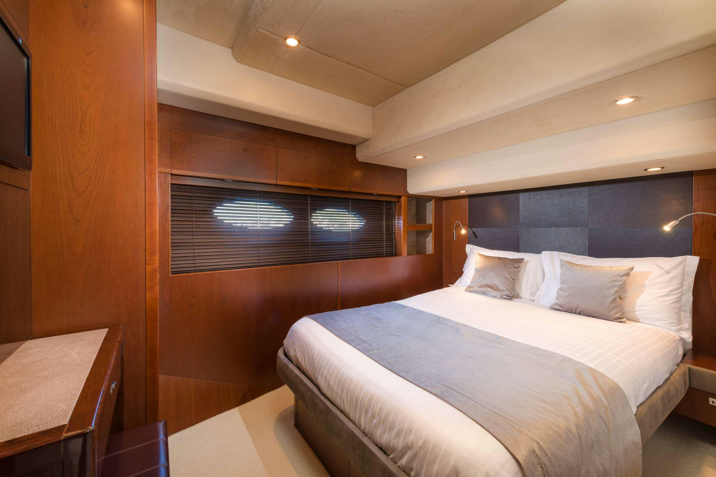 a bed in a room aboard PRINCESS 72 FLY CHAMPION Yacht for Charter