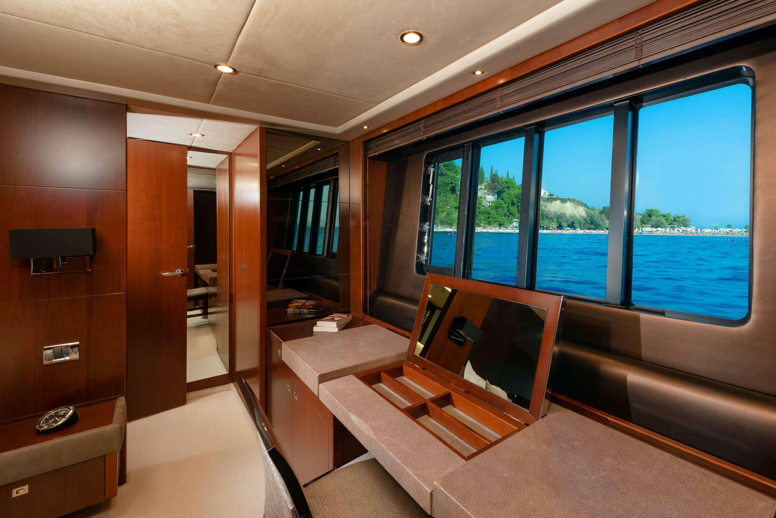 a room with a bed and a window aboard PRINCESS 72 FLY CHAMPION Yacht for Charter