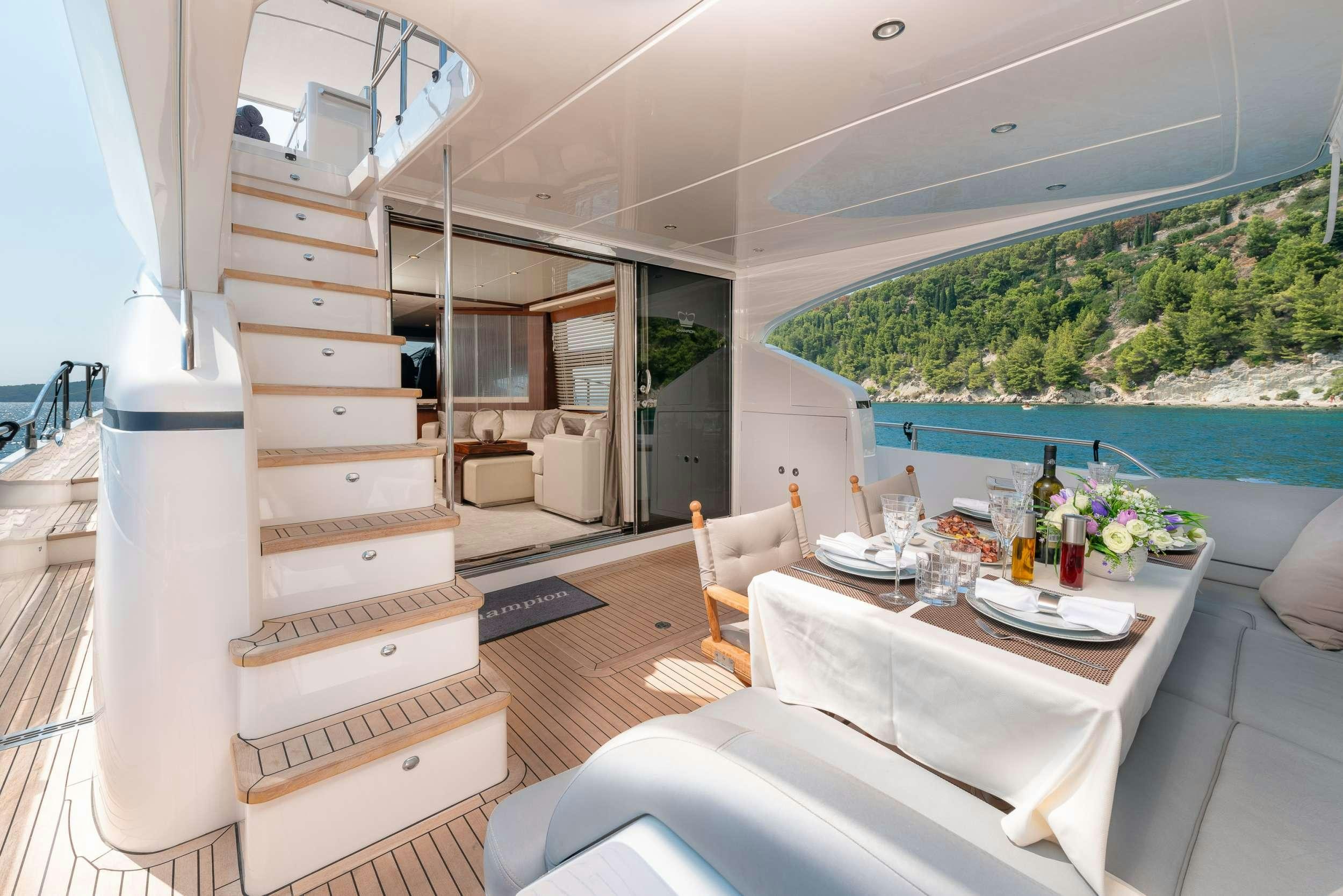 a room with a table and chairs aboard PRINCESS 72 FLY CHAMPION Yacht for Charter