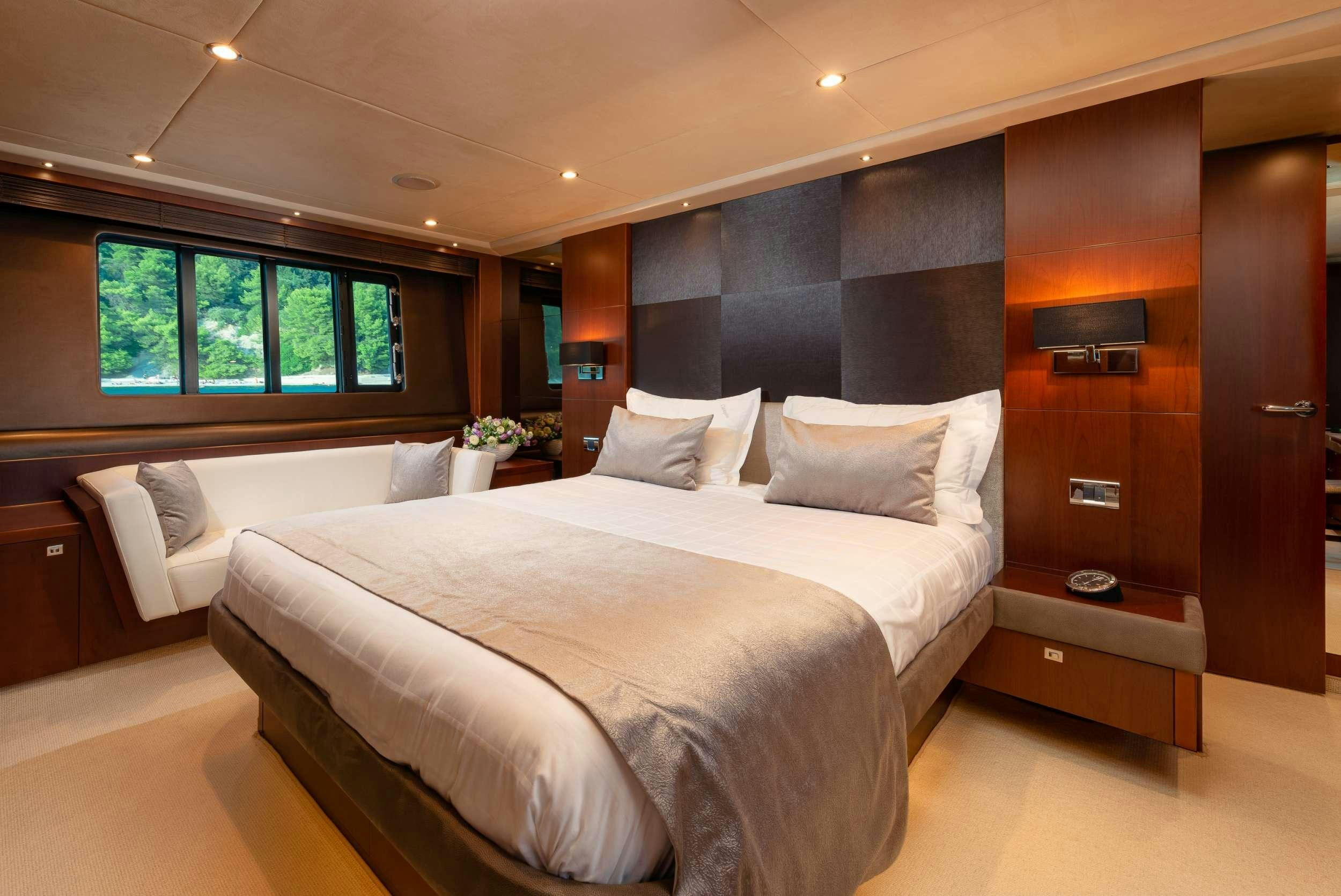 a room with two beds aboard PRINCESS 72 FLY CHAMPION Yacht for Charter