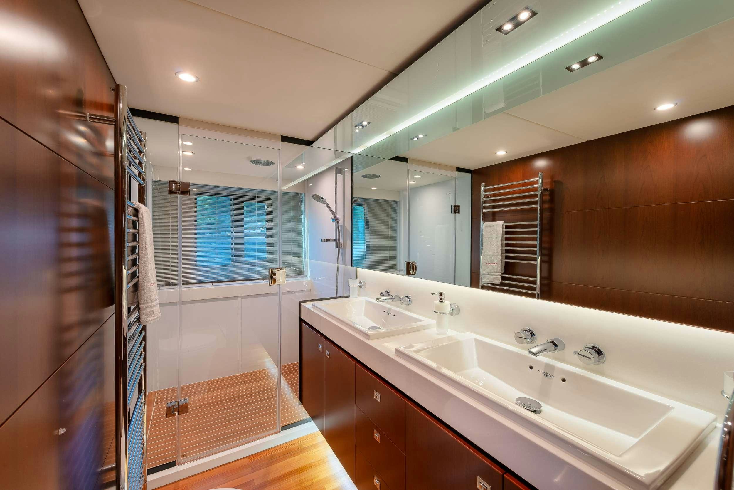 a bathroom with a large mirror aboard PRINCESS 72 FLY CHAMPION Yacht for Charter