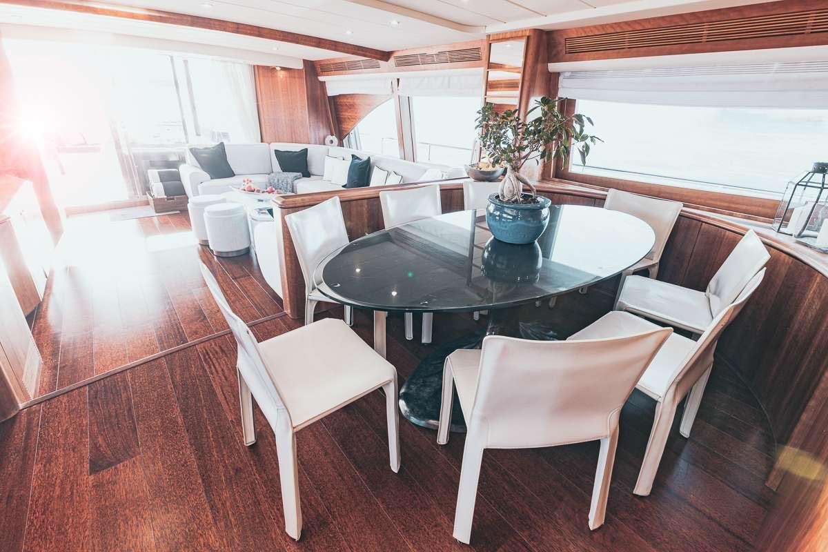 a dining room with a table and chairs aboard LADY AMANDA Yacht for Charter