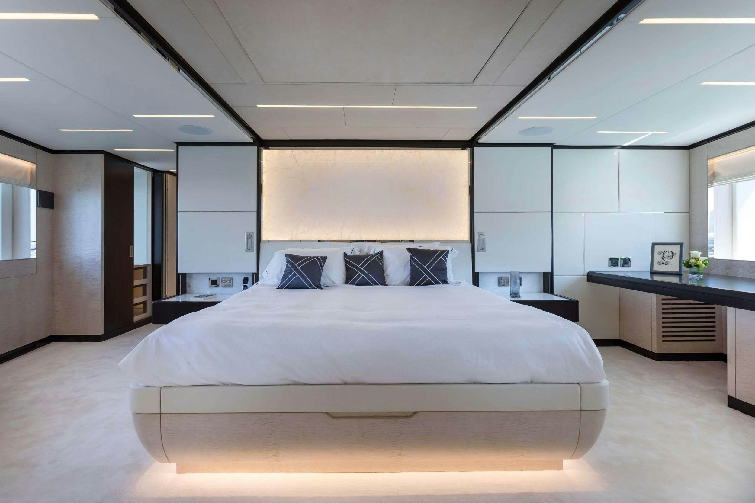 a large white bed in a room aboard ROCKET ONE Yacht for Charter