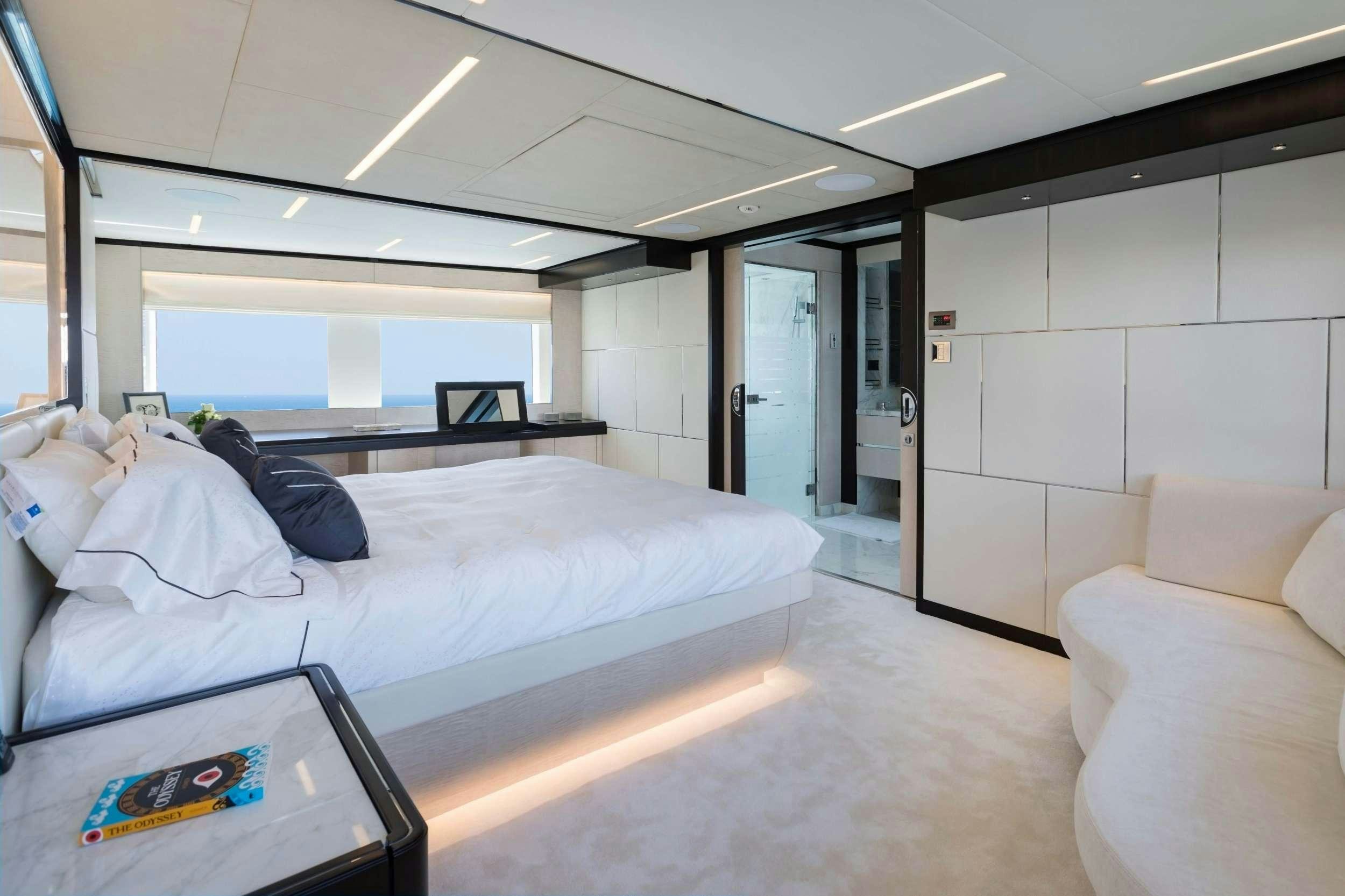 a room with a bed and a couch aboard ROCKET ONE Yacht for Charter