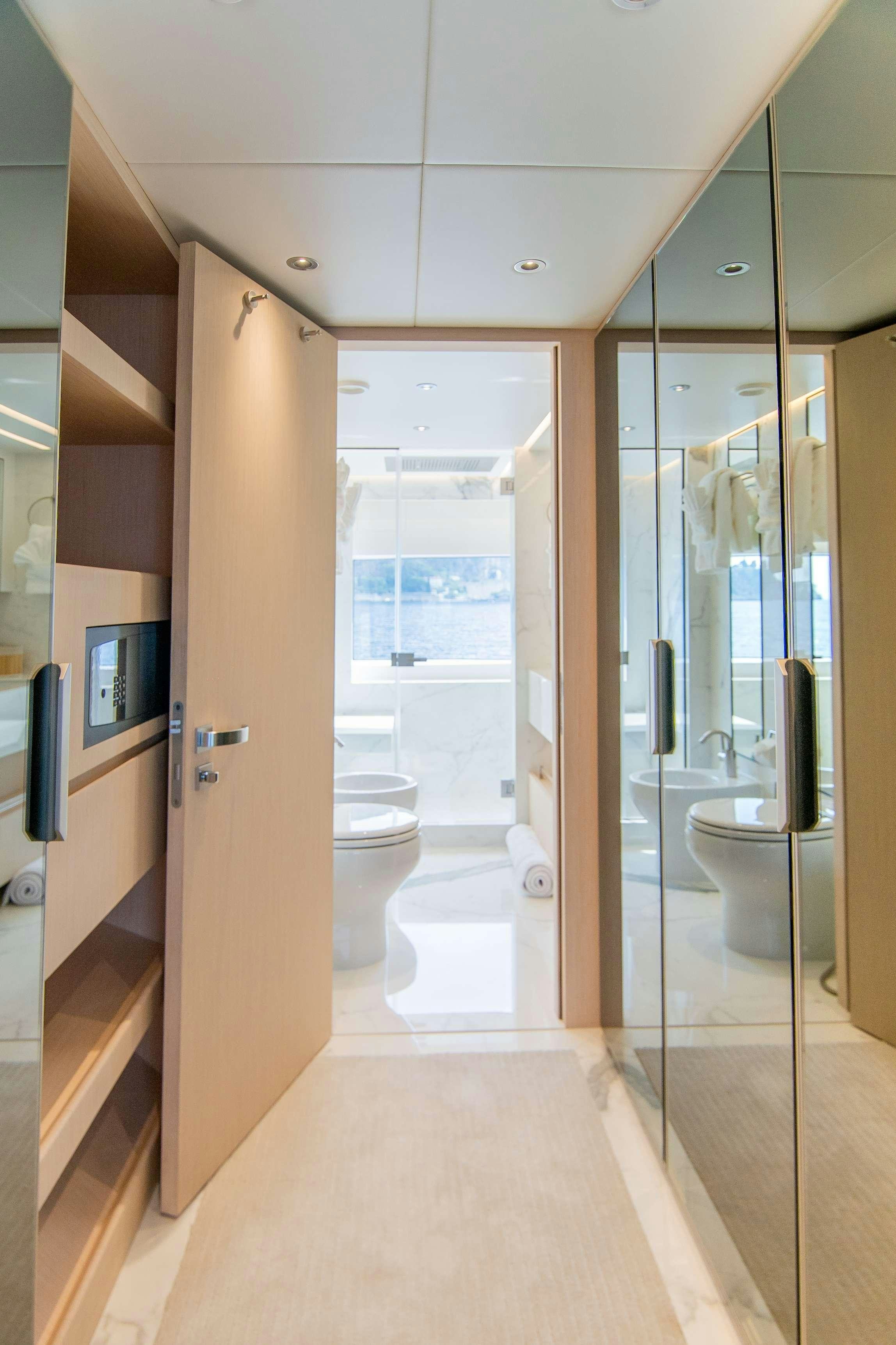 a bathroom with a glass shower aboard OCEAN VIEW Yacht for Charter