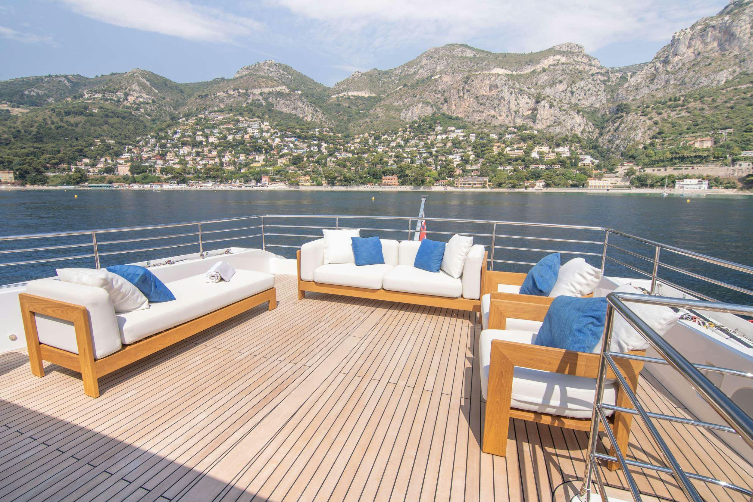 a deck with beds on it aboard OCEAN VIEW Yacht for Charter