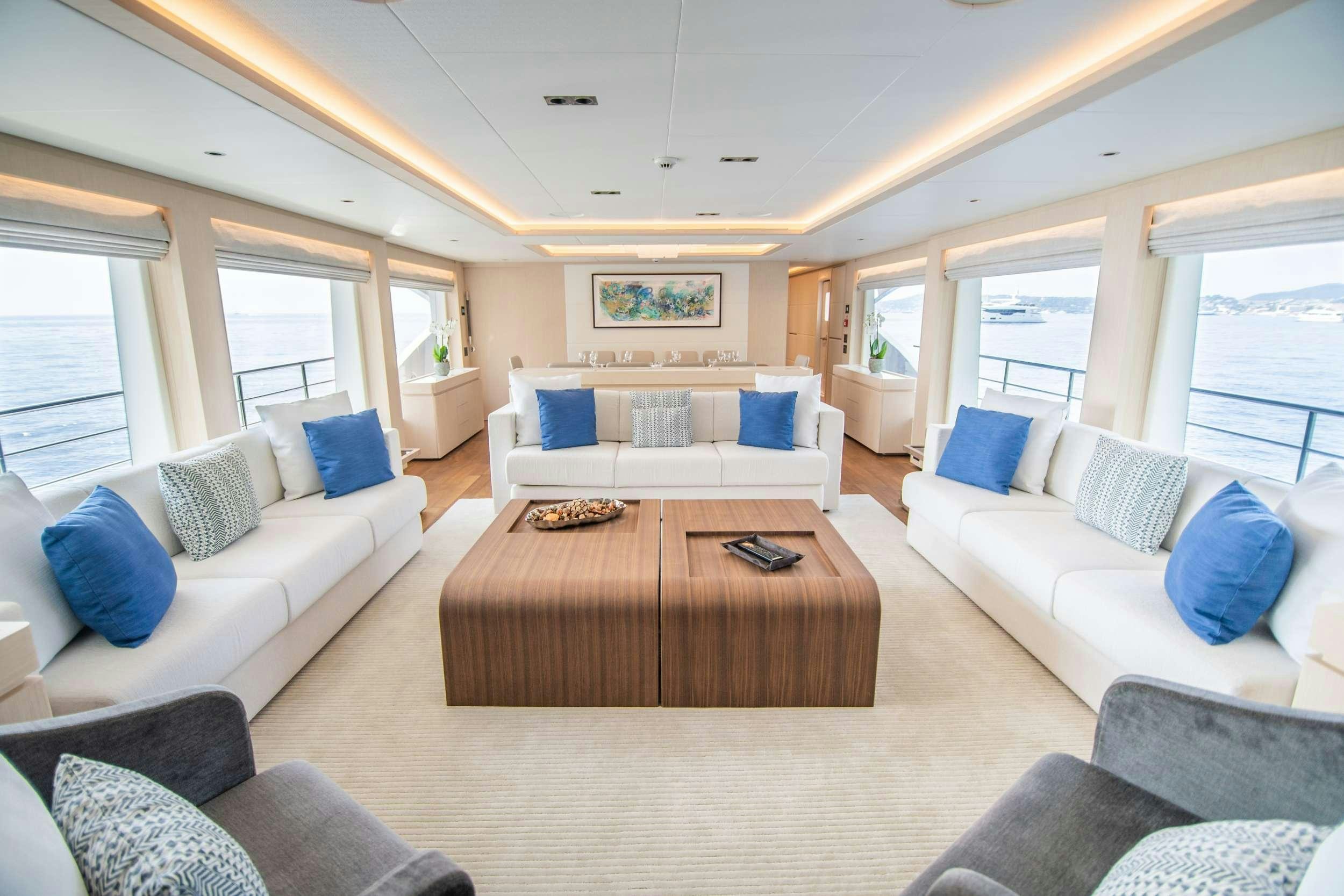 a living room with a couch and a table aboard OCEAN VIEW Yacht for Charter